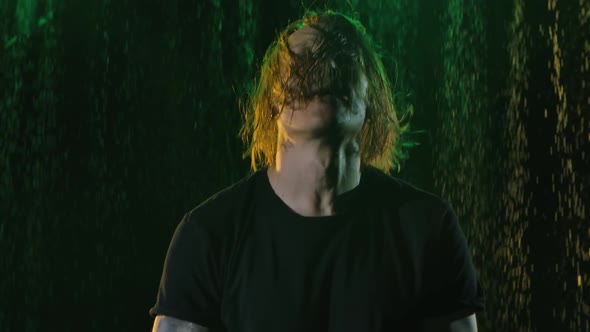 Long Haired Rock Musician Emotionally Sings Gestures and Moves Expressively to the Beat of Music alt