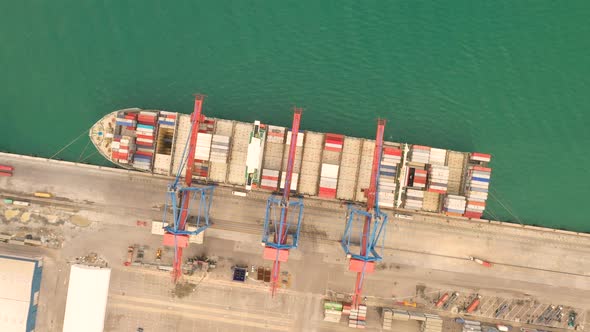 Aerial view of colourful container ship at Malage Port, Spain alt