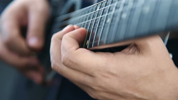 Musician Playing On Acoustic Guitar