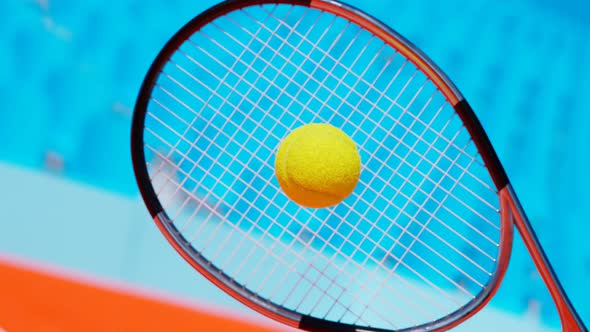 Slow-motion animation of the tennis racket striking the ball. A ball hit. 4 K HD alt