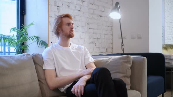 Serious Creative Designer Sitting in Office alt