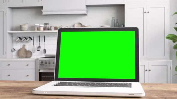 Laptop màn hình xanh trên bàn với nền tảng nhà bếp - Sự kết hợp giữa máy tính và bếp có thể mang lại cho bạn nhiều trải nghiệm thú vị. Hình ảnh này sẽ đưa bạn đến không gian thú vị với laptop màn hình xanh độc đáo. Hãy nhấn vào hình để khám phá và tận hưởng không gian làm việc mới lạ.