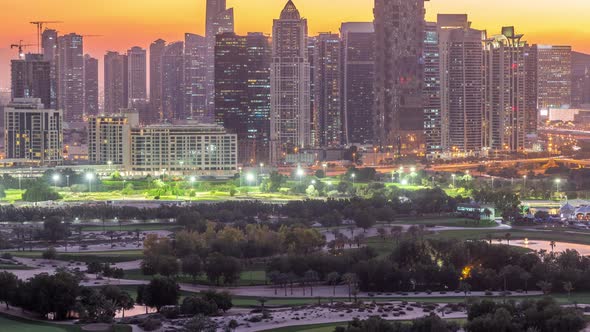 Jumeirah Lake Towers Skyscrapers and Golf Course Day to Night Timelapse Dubai United Arab Emirates alt
