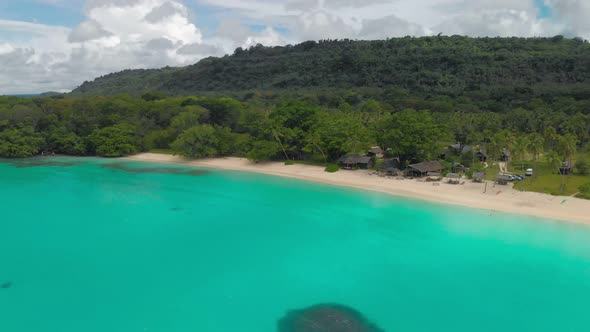 Port Orly sandy beach with palm trees, Espiritu Santo Island, Vanuatu alt