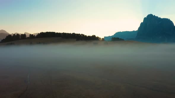 Autumn Morning and Bright Misty Sunrise in the Valley of Compaccio. Province of Bolzano, Italian