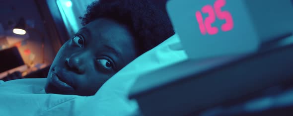 African American Woman Suffering from Insomnia alt
