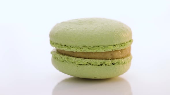 Green Macaron Pastries Rotate on White Background Food Concept
