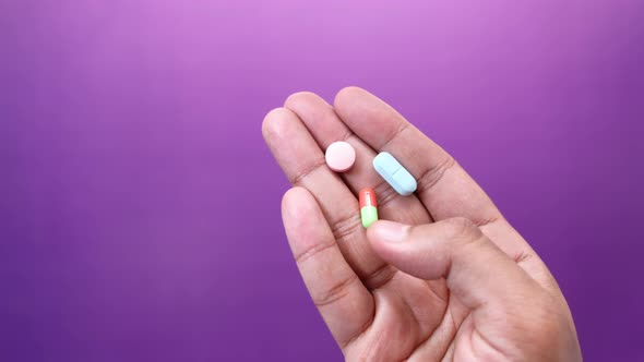 Top View of Man Hand Taking Medicine  alt