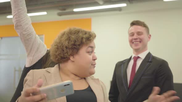 Portrait of Angry Woman in Formal Wear Speaks By Her Cellphone alt