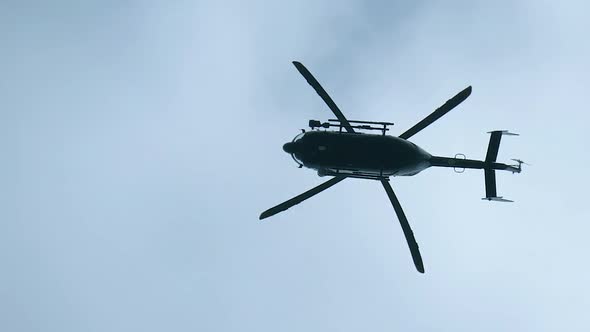 Helicopter Motionlessly Hovered in the Sky