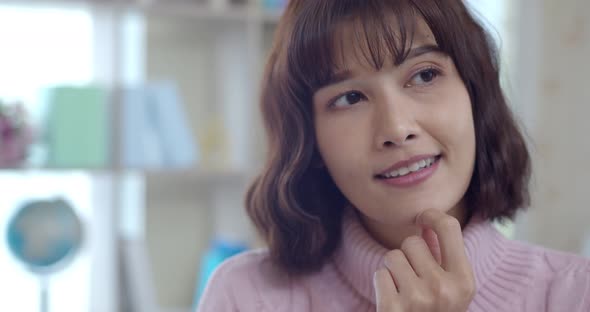 Headshot portrait of Thoughtful Young Woman with happy alt