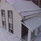Drone shot of new white modern residential house at winter near the forest 06 - VideoHive Item for Sale