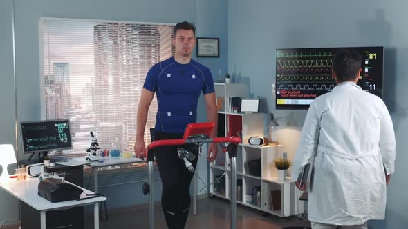 Cardiologist Coming to Monitor Athlete's Stress Testing on Treadmill alt