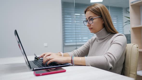 Beautiful Woman, Office Worker Using Laptop at Office. Female Freelance,  Manager., Stock Footage