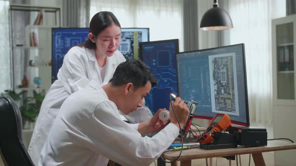 Development Facility: Asian Team Of Engineers, Scientists Work On Computer, Talk, Design Pcb alt