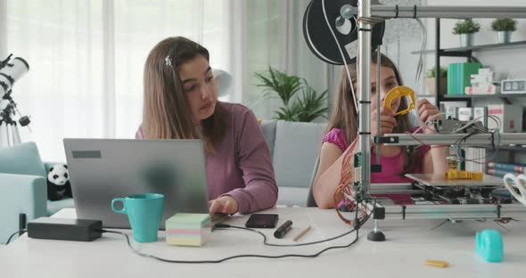 Young girls learning 3D printing at home