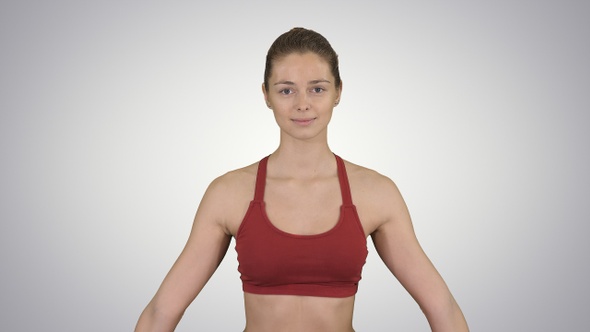 Young woman sitting in lotus pose and meditating with closed alt