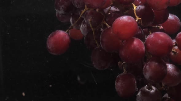 Slow Motion of Red Grapes in Water