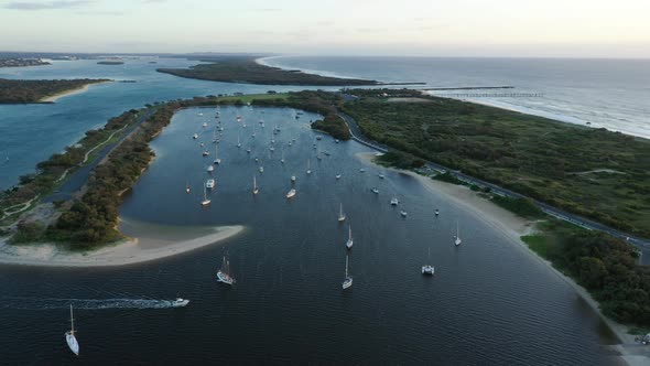 Aerial pan from Gold Coast Broadwater out over the Spit, Suriseand golden Beaches alt