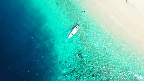 Beautiful birds eye island view of a sandy white paradise beach and blue water background in colourful alt
