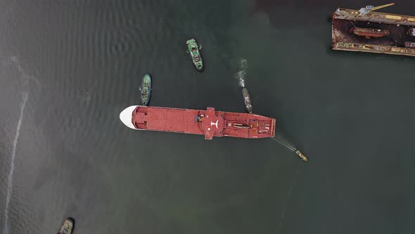 Tugs Mooring the Ferry That Arrived at the Port for Completion at the Shipyard alt