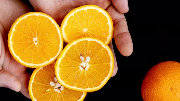 Orange slices on the palm.
