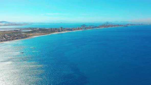 Aerial View. Flight Over Gorgeous Islands, Long Spit La-Manga,Spain, Beautiful Azure Sea and Hills alt