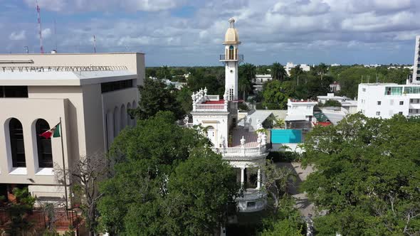 Aerial trucking shot to the right of the el Minaret mansion on the Paseo de Montejo in Merida, Yucat alt