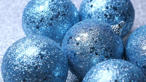 New Year Blue Spruce Tree Decoration Balls on Shiny Silver Background alt