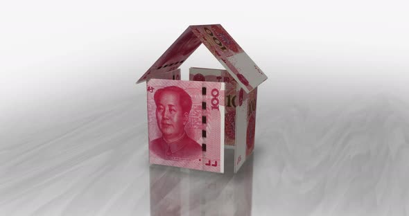 China Yuan 100 CNY money banknotes paper house on the table