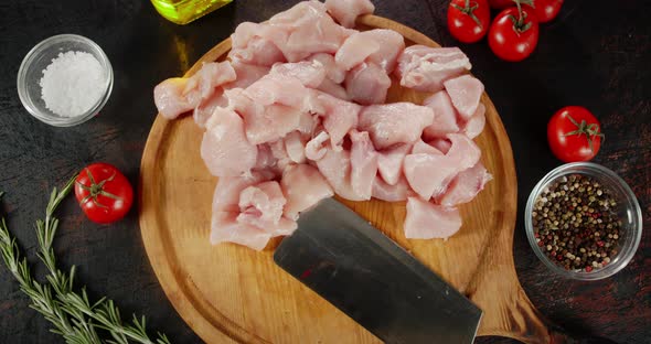 Pieces of Raw Chicken Fillet with Tomatoes, Spices Rotate alt