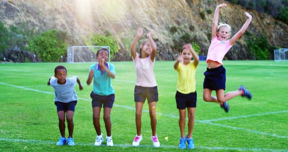 School kids having fun in playground alt