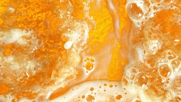 Super Slow Motion Shot of Rippling Fresh Beer Wave From Top Shot at 1000Fps. alt