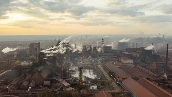 Aerial Hyperlapse Time Lapse, Steel Factory Pipes During Sunrise Time alt