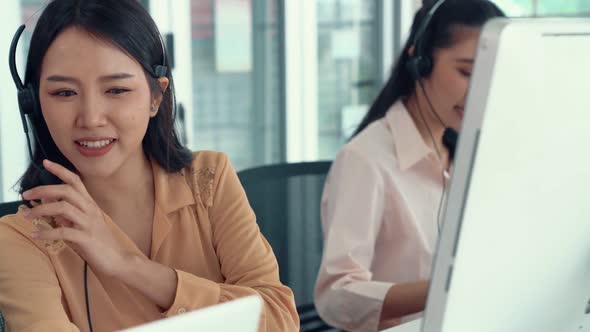 Business People Wearing Headset Working Actively in Office alt