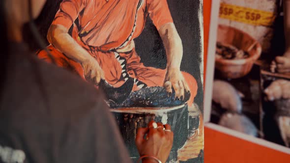 Young Woman Painter Drawing asian girl Painting On Easel in studio alt