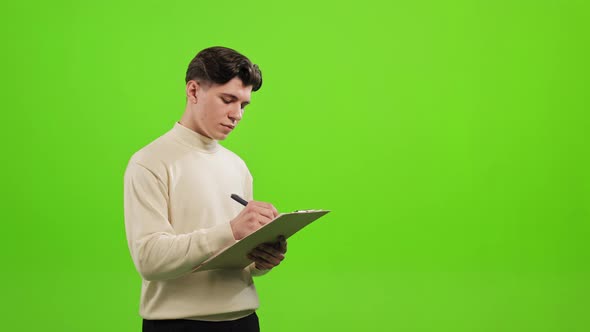 The Man is Standing and Looking at the Camera alt