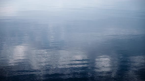 Water calmly moving in the morning. alt