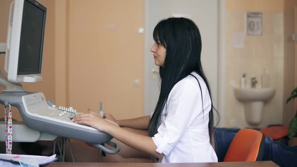 Echocardiography and Ultrasonography in the Doctor's Office Female Doctor Examining a Patient's alt