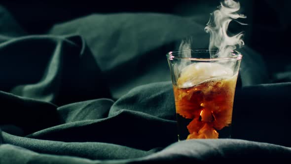 Brown Cocktail with Dry Ice alt