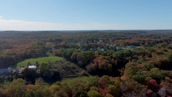 Buildings of Haverhill town and endless forestry landscape with autumn colors, aerial drone view alt
