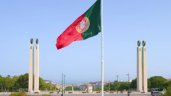 National Flag of Portugal Waving in the Wind on Clear Sunny Day at Blue Sky in Park of Edward VII alt