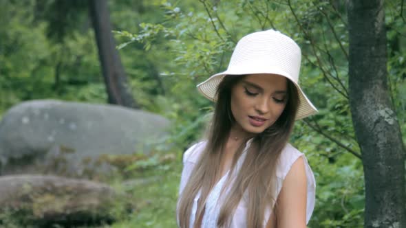 Beautiful girl posing in forest