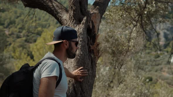 Man Walks Shoot Mobile Photo In Ancient Town Turkey Kemer Archeology. Tourist Photo Smartphone. alt