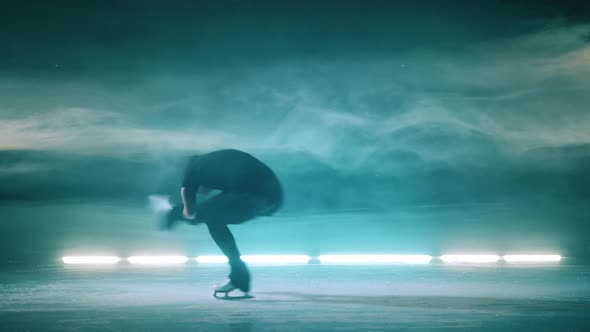Young Lady is Performing a Sit Spin While Skating alt