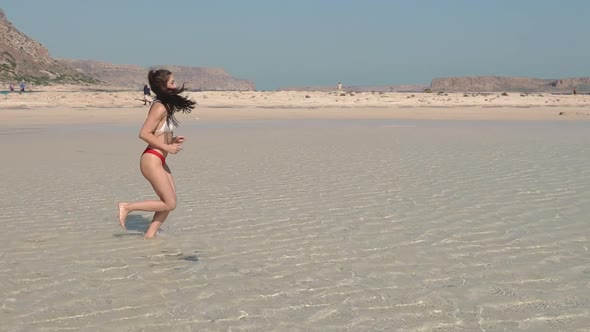 Young Asian Women Exercising with Outdoor Running Mountain Sea Background alt