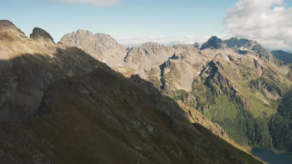Aerial view of highland landscape, drone movin near mountains