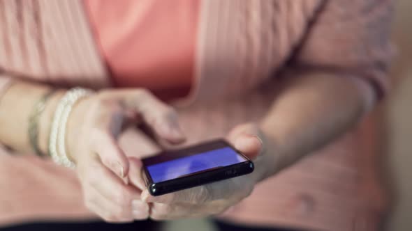 Grandmother Scrolling On Screen On Cellphone. Senior Woman Using Smartphone For Social Networks. alt