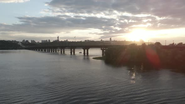 Sunset Over the River Dnipro in Kyiv Reflections in the Water Landscape alt
