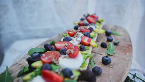 A delicious bread veggie platter for good, healthy meal of avocado and tomatoes baguette sandwich -  alt